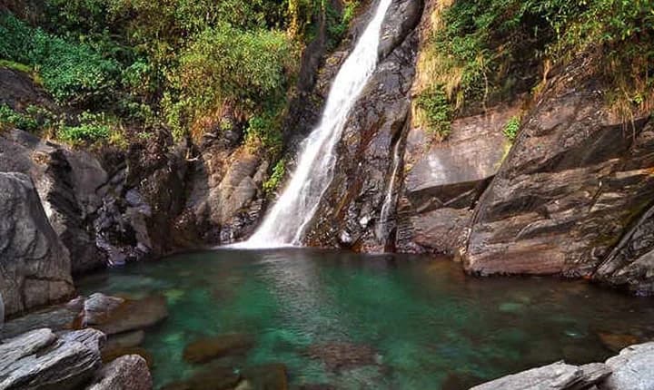 Waterfall trek in Kangra Valley with forest pool